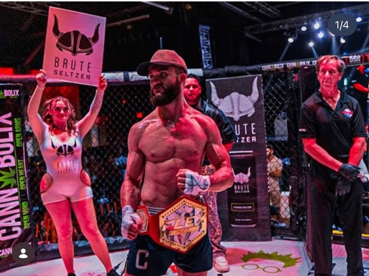 Gabriel Cabello, coach at Immortals Jiu Jitsu, holding a championship belt in the cage after an MMA win.